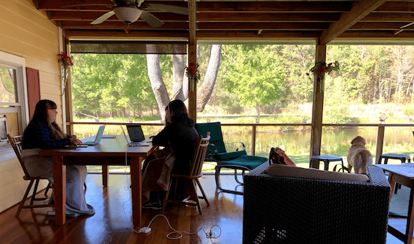 An image of the Olark team working at a table. Once you’ve started capturing live chats in your CRM, sit with your sales team and determine what your workflows are going to be.