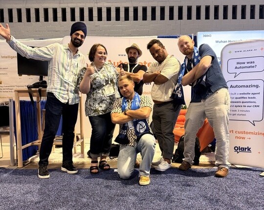 Members of the Olark support and engineering team at a conference booth